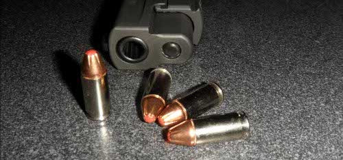 Sig Sauer pistol with loose cartridges